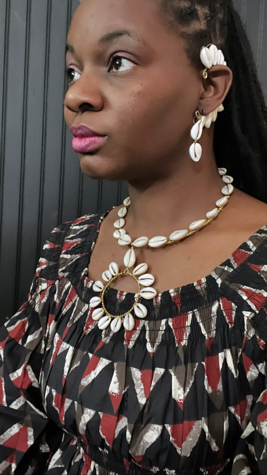 Catarina Cowrie & Brass Bib